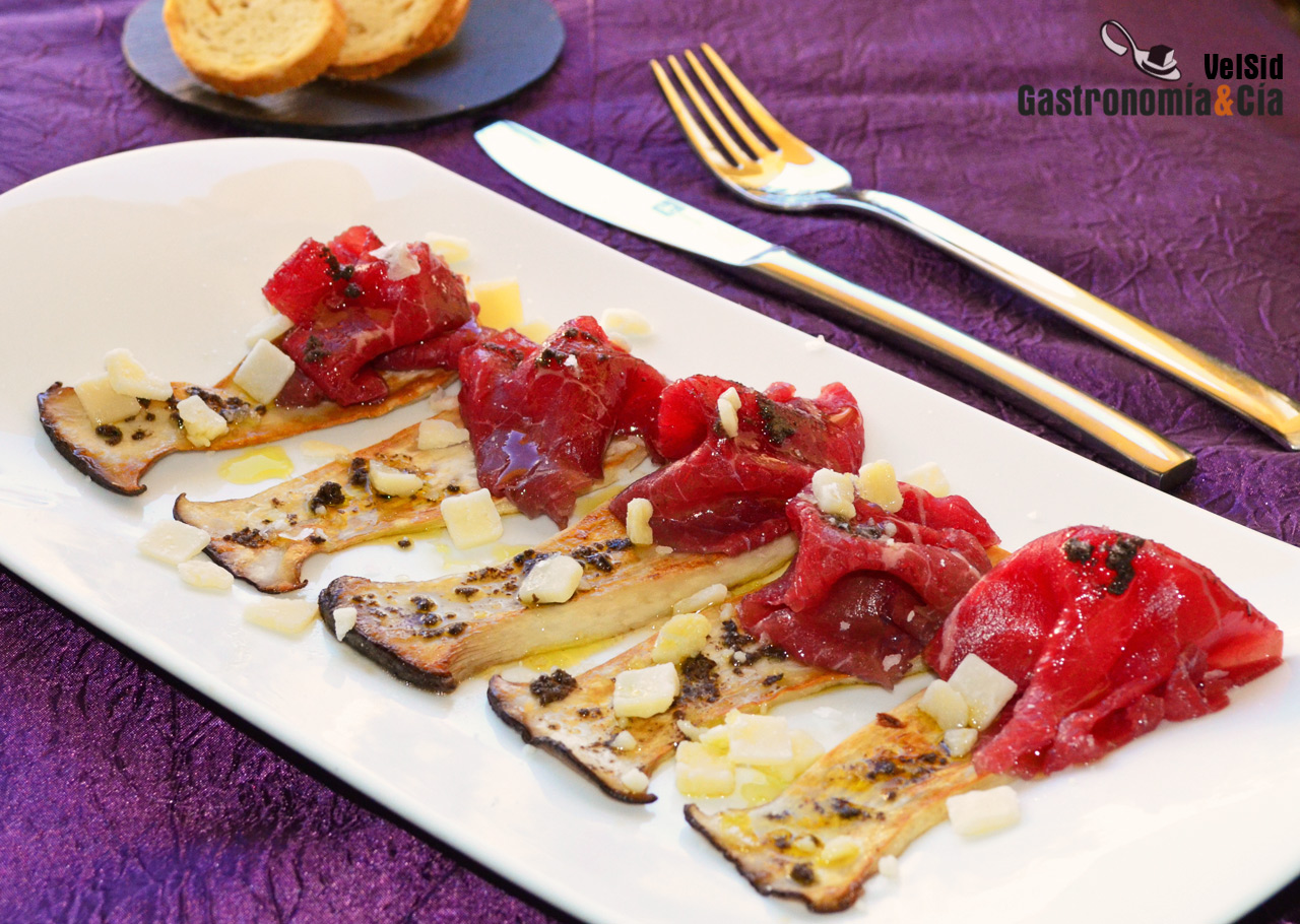 Carpaccio de buey con setas confitadas y trufa negra