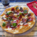 Pizza blanca con jamón ibérico, trufa negra y parmesano