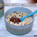 Porridge con puré de plátano y crema de chocolate y cac