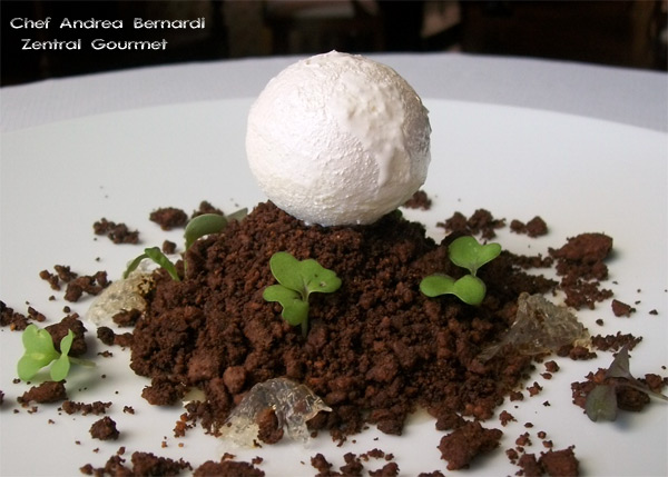 Mousse de leche de cabra infusionada con anís, bienmesabe, bizcocho y la tierra volcánica elaborada con cacao y café Agaete, malvasía y una compota de limón