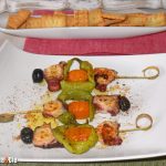 Pulpo, piparras y tomatitos